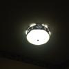 a custom made southwestern style light fixture in the laundry room